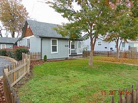 Cute Fenced Front Yard with An Inviting Covered Porch. in Medford, OR