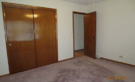 This Single Story Home Glistens with Fresh Paint and Hardwood F in Aurora, IL (Photo 6 of 6)