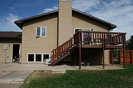 Large Fenced in Yard with Deck and Storage Shed.  in Laramie, WY (Photo 2 of 7)