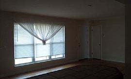 This 3 Bed and 2.5 Bath Home Features a Fenced in Backyard in Little Rock, AR (Photo 2 of 8)