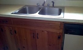 This 3 Bed and 2.5 Bath Home Features a Fenced in Backyard in Little Rock, AR (Photo 4 of 8)