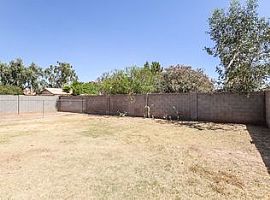 8719 W Bobby Lopez Dr, Tolleson, Az 85353 3 Beds 2 Baths 1,519  in Tolleson, AZ (Photo 3 of 9)