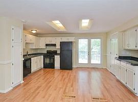 The Kitchen Is Equipped with Updated Appliances in Arvada, CO (Photo 4 of 6)