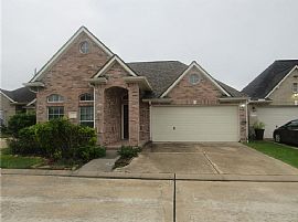 This Home Features a Glass Front Door, Hardwood Floors in The E in Houston, TX
