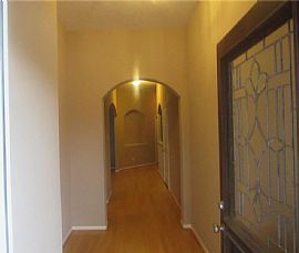 This Home Features a Glass Front Door, Hardwood Floors in The E in Houston, TX (Photo 2 of 5)