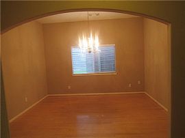 This Home Features a Glass Front Door, Hardwood Floors in The E in Houston, TX (Photo 4 of 5)