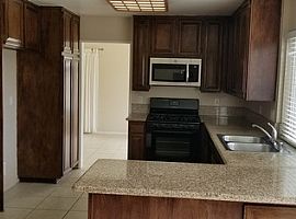 The Property Has Neutral Tiled Floors Downstairs and Carpet Ups in Mission Viejo, CA (Photo 8 of 10)