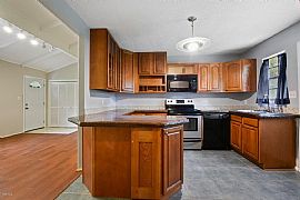 This Is a Country Charm Home with City Convenience. 1.5 Story A in Gulfport, MS (Photo 5 of 8)