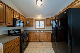 Enjoy The Morning Sunshine in The Large Upper Level Living Room in Sioux Falls, SD (Photo 4 of 6)