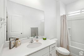 Home Featuring a Modern Aesthetic Throughout. It Boasts a Spaci in Lehi, UT (Photo 10 of 12)