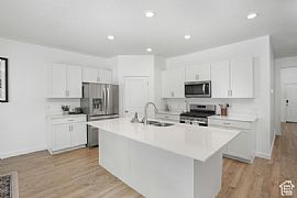 Home Featuring a Modern Aesthetic Throughout. It Boasts a Spaci in Lehi, UT (Photo 3 of 12)