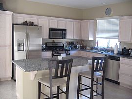 CHARMING TRI-LEVEL HOME IN TUSCANO  in Henderson, NV (Photo 2 of 5)