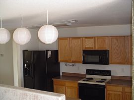 This home sides to a grassy common area w/ volleyball court  in Queen Creek, AZ (Photo 2 of 4)