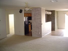 This home sides to a grassy common area w/ volleyball court  in Queen Creek, AZ (Photo 3 of 4)