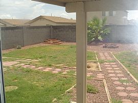 This home sides to a grassy common area w/ volleyball court  in Queen Creek, AZ (Photo 4 of 4)