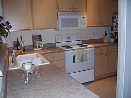 Ideal 2 Bedroom Condo in Secure Building with Garage Parking in Newcastle, WA