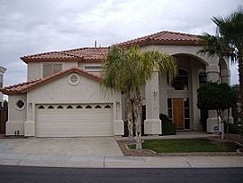 Comfy 4 Bedroom Home with Office in Gated Lake Community in Gilbert, AZ