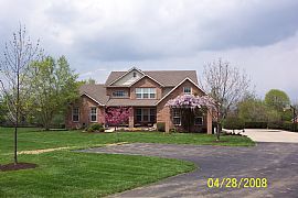 Spacious 4 Bedroom Home on 2.5 Acres with Stocked Pond in Liberty Township, OH