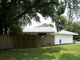 Terrific 3 Bedroom Home with 1 Car Garage with Fenced Yard in Palm Bay, FL (Photo 7 of 8)
