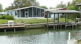 Gorgeous 3 Bedroom Canal Front Home with Dock in Oak Hill, FL