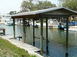 Gorgeous 3 Bedroom Canal Front Home with Dock in Oak Hill, FL (Photo 2 of 8)