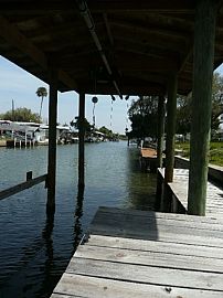 Gorgeous 3 Bedroom Canal Front Home with Dock in Oak Hill, FL (Photo 8 of 8)