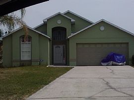 Spacious 3 Bedroom Home with Screened in Pool and Lake in Kissimmee, FL