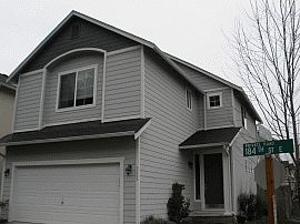 Pleasant 3 Br, 2.5 Ba Home with Great Fireplace in Puyallup, WA