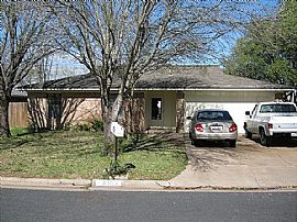 Three Bedroom Two Bath Home with a Two Car Garage and Large Fen in College Station, TX (Photo 4 of 4)