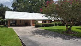 This Spacious Home Sits Right Off I-49 and Offers a Large Maste