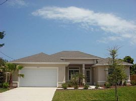 Walk to the beach in this 4BR/2BA