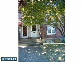 WOW! An All Brick, 3 Bedroom Row Home with Garage and Yard