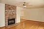 Room with brick fireplace